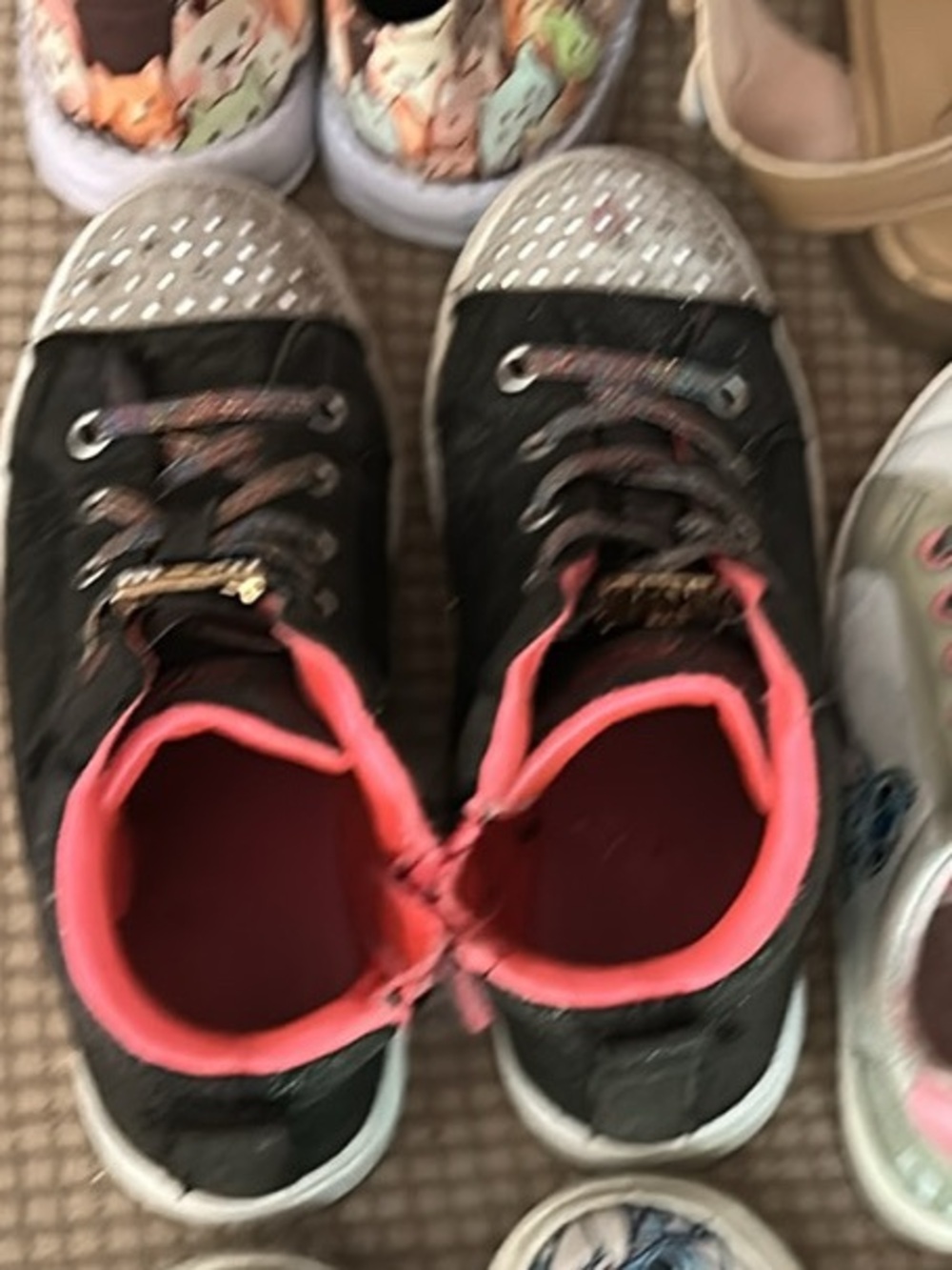 Skechers Black Sneakers with Pink Lining and Silver Glitter Toes light up.